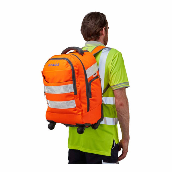Person carrying on his shoulders the Pulsar orange hi vis rail spec cordura trolley backpack